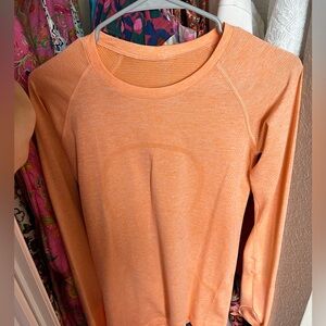 Orange Lululemon long sleeve swiftly tech